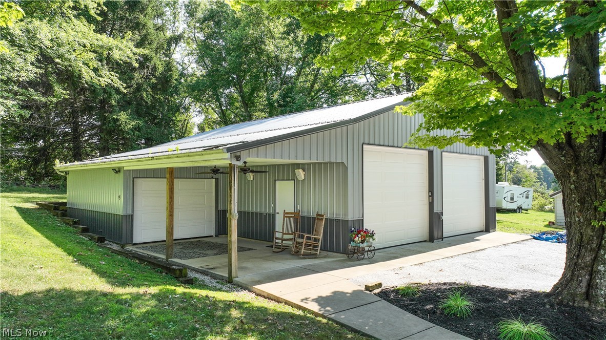 38610 Spiedel Town Road Bethesda, OH 43719 - Photo 5 of 33 View of outdoor structure with a garage and a lawn