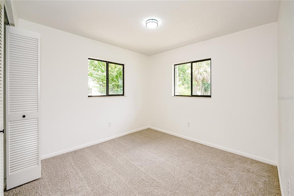 26 Seneca Path Palm Coast, FL 32164 - Photo 11 of 15 an empty room with windows