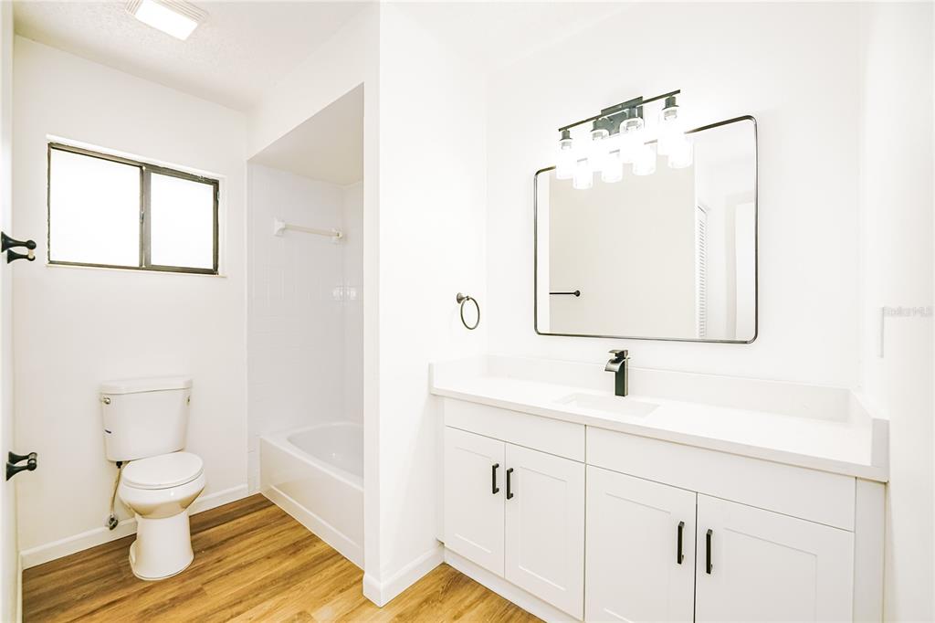 26 Seneca Path Palm Coast, FL 32164 - Photo 13 of 15 a bathroom with a toilet sink and mirror