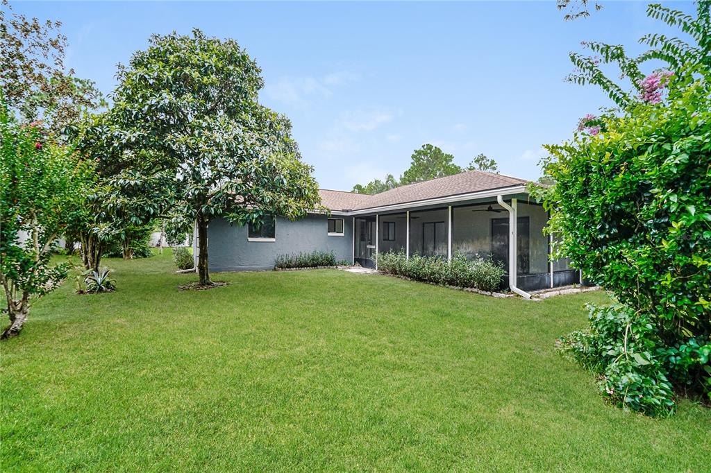 26 Seneca Path Palm Coast, FL 32164 - Photo 15 of 15 a front view of a house with a garden