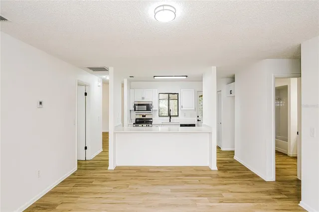 a view of kitchen with wooden floor