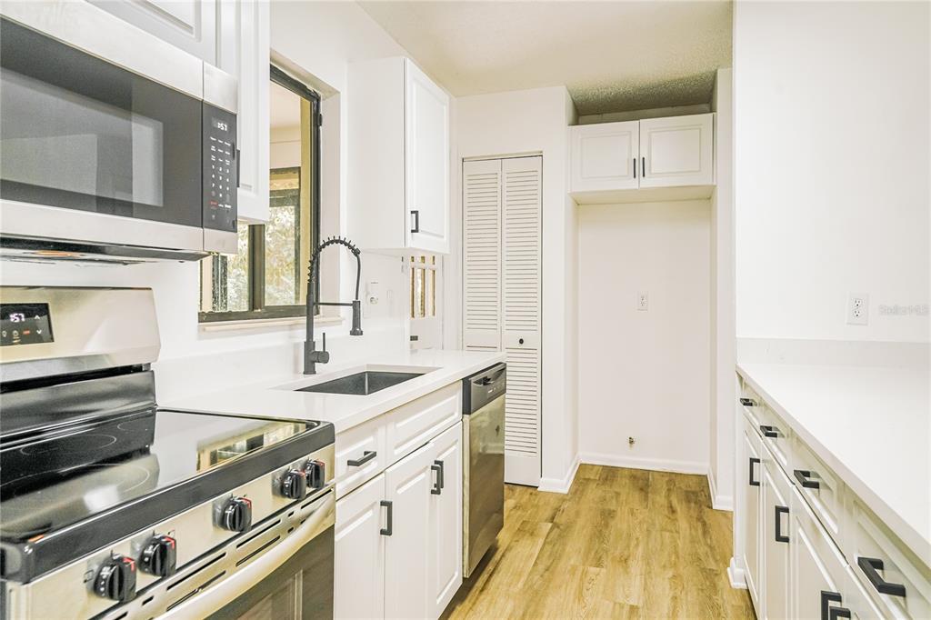 26 Seneca Path Palm Coast, FL 32164 - Photo 6 of 15 a spacious bathroom with a sink and a mirror