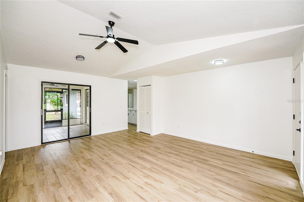 26 Seneca Path Palm Coast, FL 32164 - Photo 8 of 15 a view of empty room with wooden floor and fan