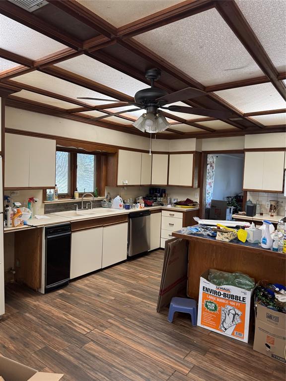 1516 South 8th Street Chillicothe, TX 79225 - Photo 13 of 28 a kitchen with stainless steel appliances granite countertop a refrigerator a stove and a wooden floors