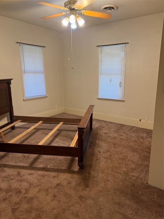1516 South 8th Street Chillicothe, TX 79225 - Photo 17 of 28 a room with a table and a chandelier