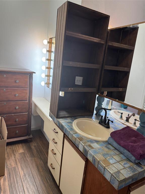 1516 South 8th Street Chillicothe, TX 79225 - Photo 21 of 28 a bathroom with a sink and a mirror
