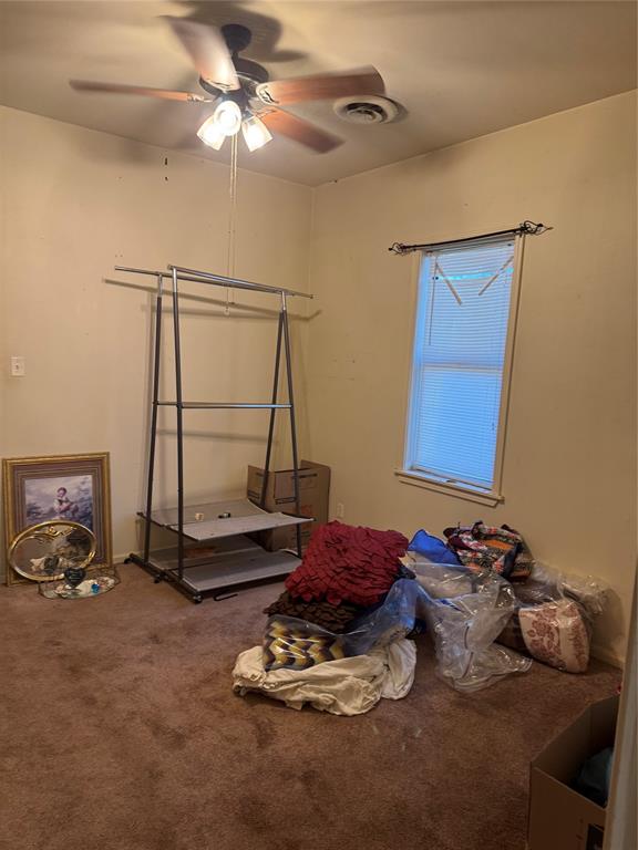 1516 South 8th Street Chillicothe, TX 79225 - Photo 24 of 28 a room with gym equipment and a mirror