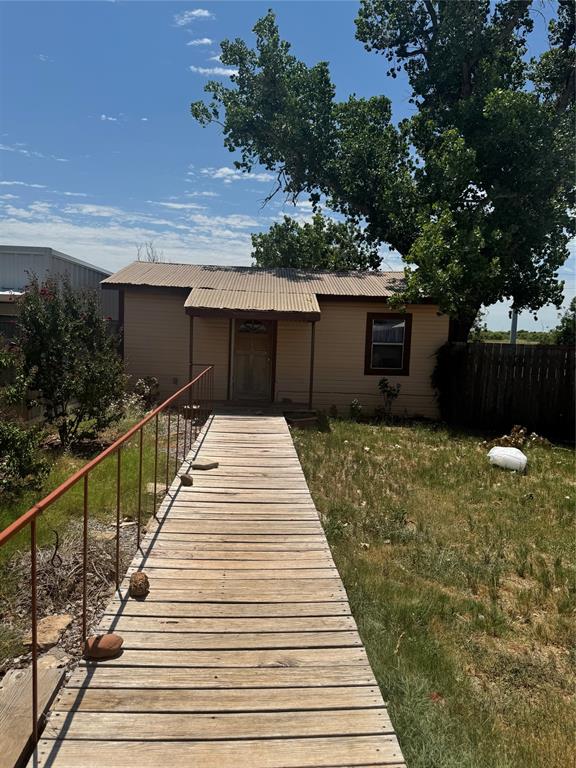1516 South 8th Street Chillicothe, TX 79225 - Photo 25 of 28 a pathway of a house with wooden fence