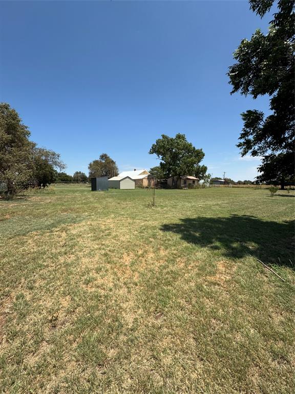 1516 South 8th Street Chillicothe, TX 79225 - Photo 9 of 28 a view of a lake from a yard