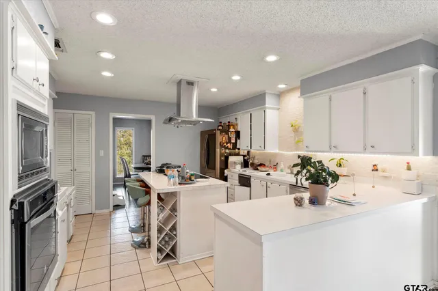 a view of a dining room with furniture and a window