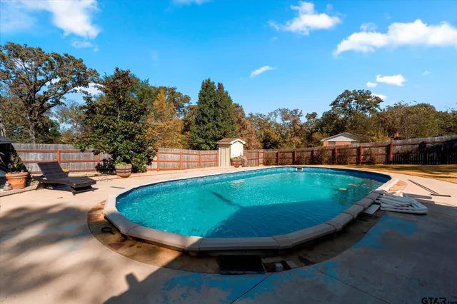 a view of yard with patio
