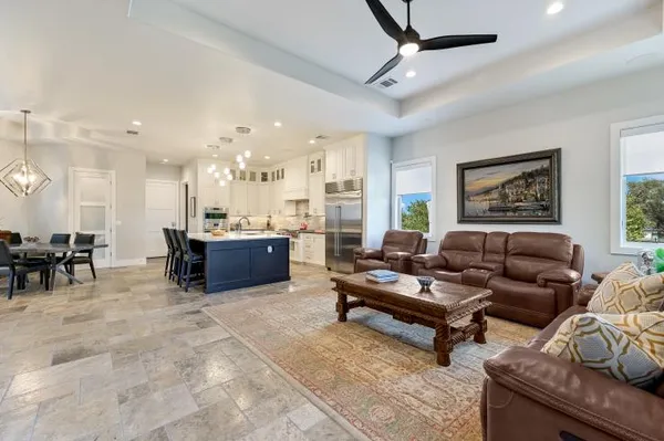 a living room with furniture and a dining area
