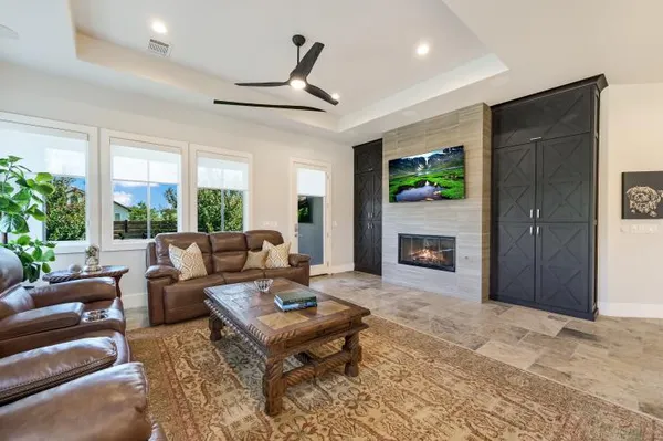 a living room with furniture a window and a fireplace