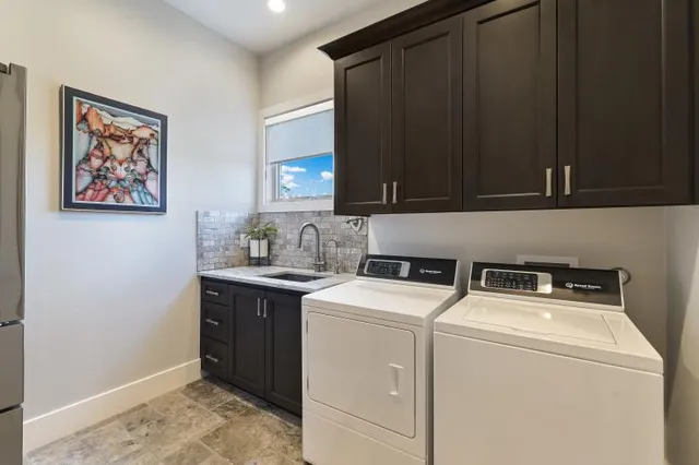 a utility room with dryer and washer