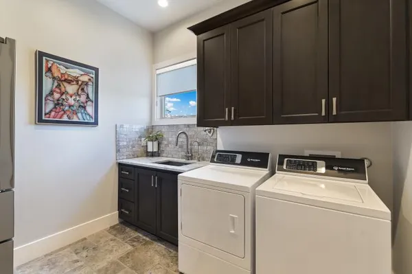 a utility room with dryer and washer