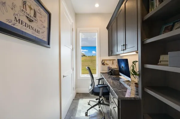 a kitchen with stainless steel appliances a stove a refrigerator and cabinets