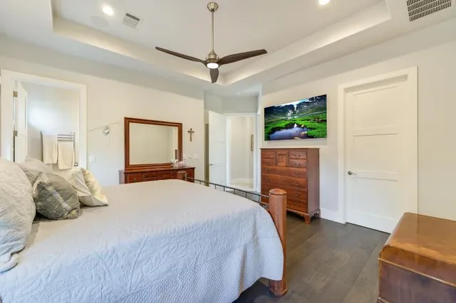 a bedroom with a bed and a couch