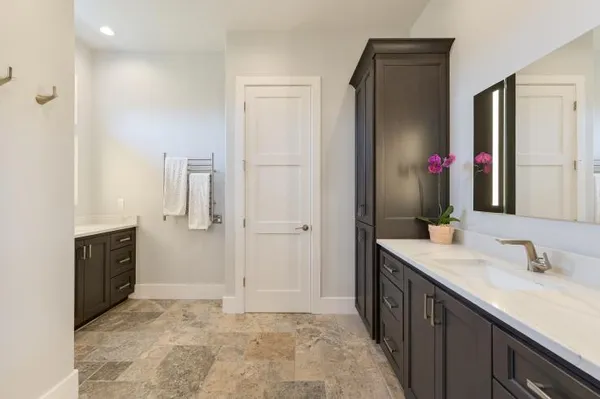 a bathroom with a sink vanity and a mirror