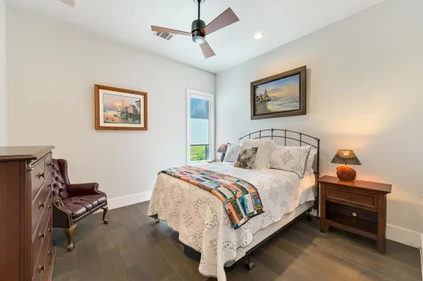 a bedroom with bed and a desk