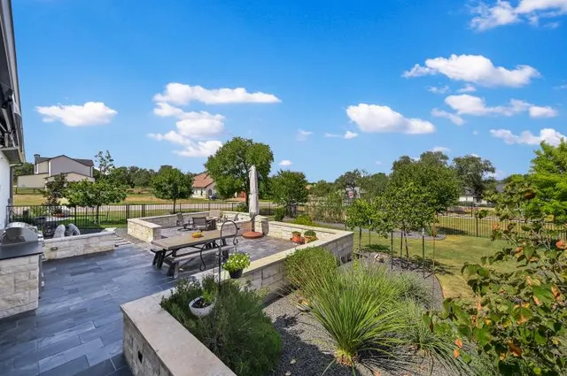 a view of yard with patio