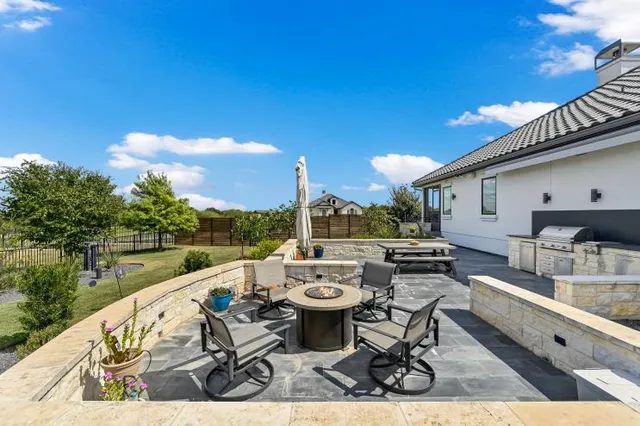a view of swimming pool with outdoor seating