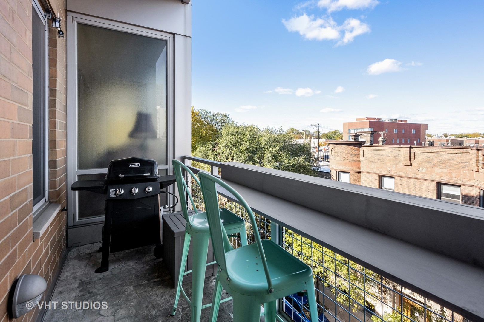 3920 North Sheridan Road, Unit 403 Chicago, IL 60613 - Photo 12 of 13 a view of a balcony dining table and chairs
