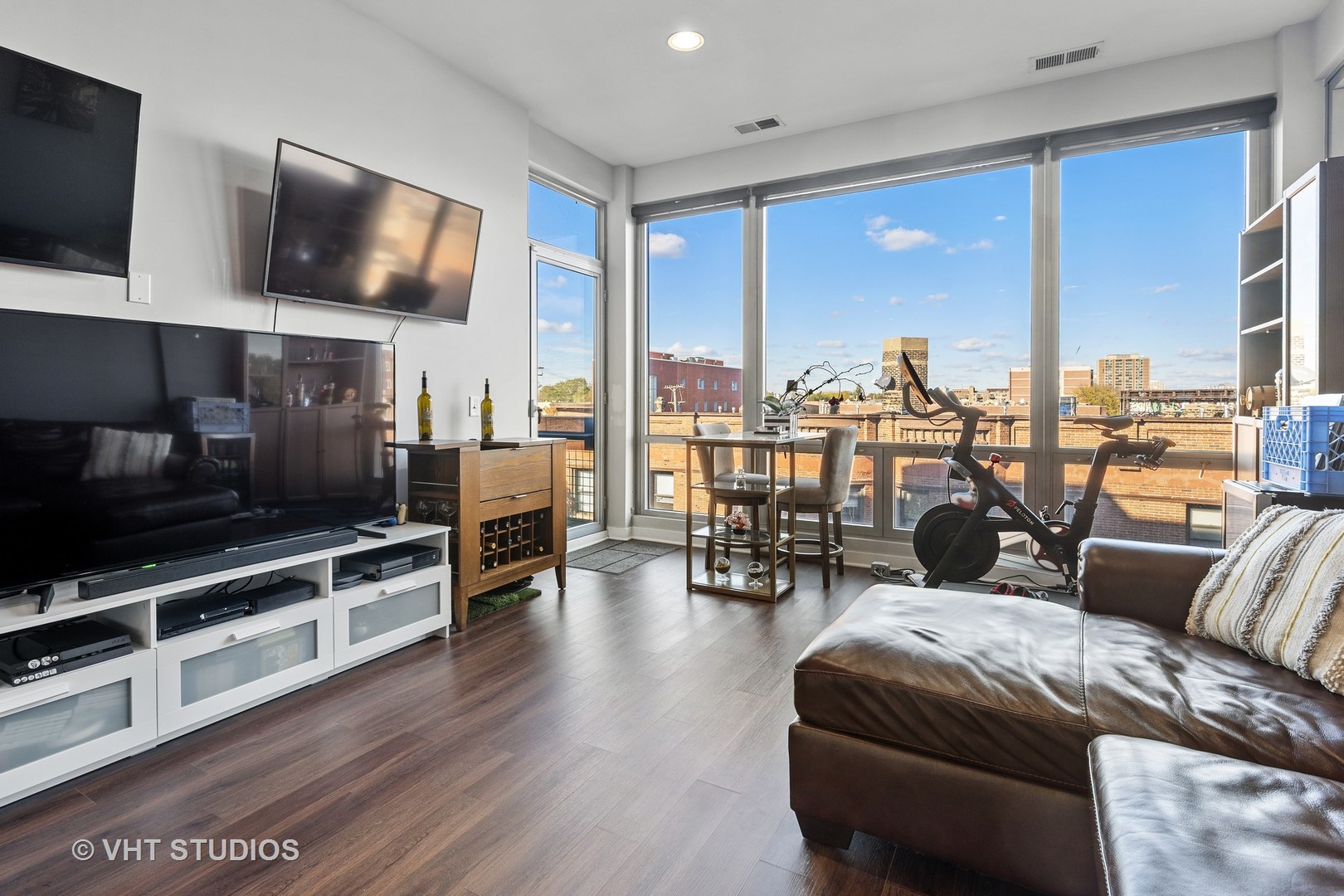 3920 North Sheridan Road, Unit 403 Chicago, IL 60613 - Photo 5 of 13 a living room with fireplace furniture and a flat screen tv