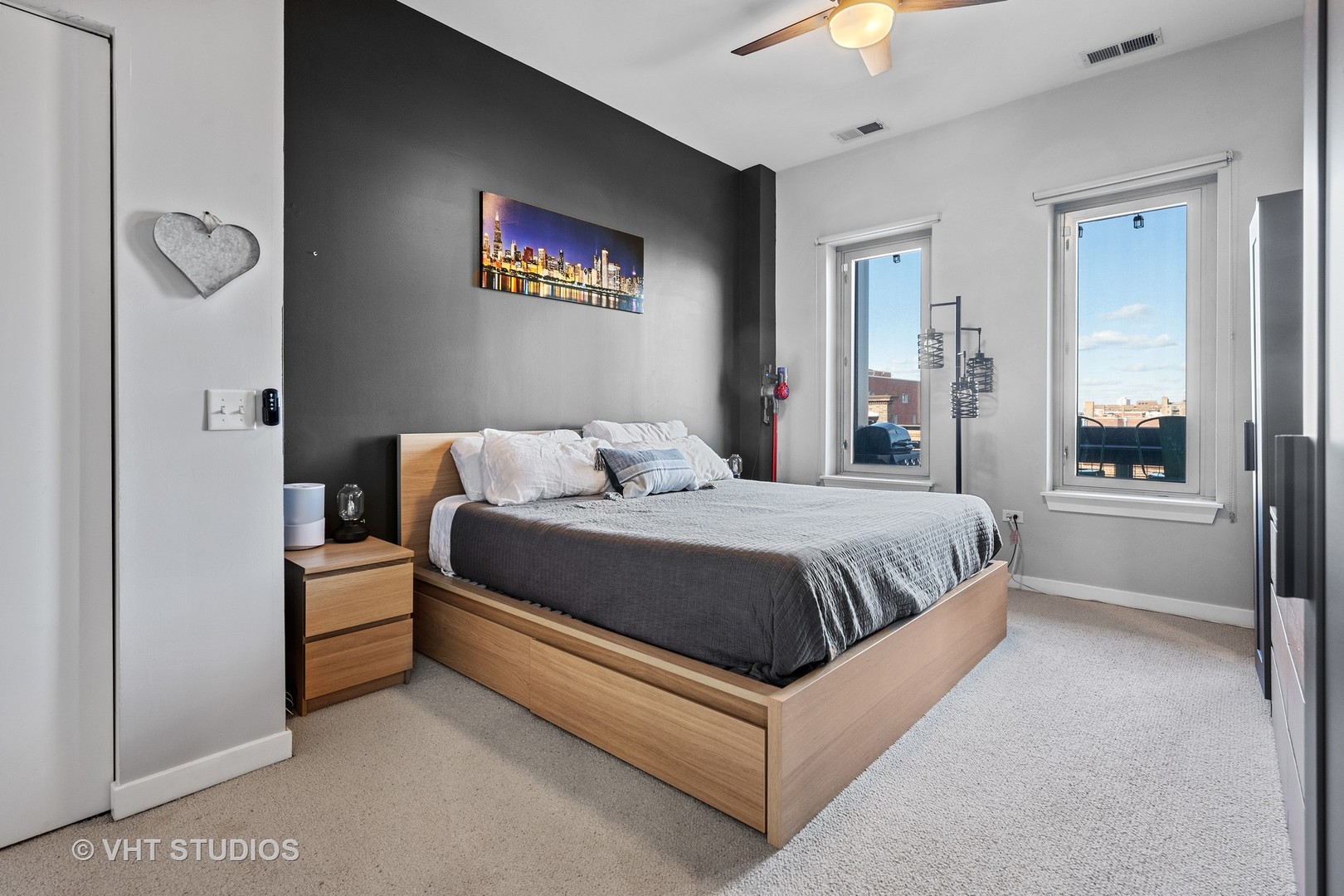 3920 North Sheridan Road, Unit 403 Chicago, IL 60613 - Photo 6 of 13 a bedroom with a bed and a chandelier