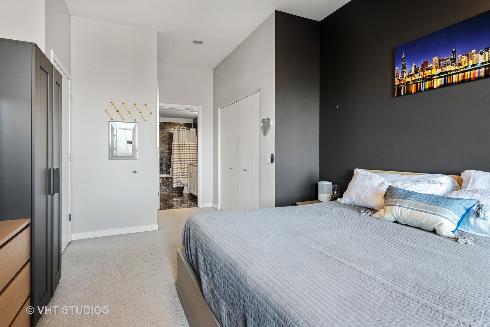 3920 North Sheridan Road, Unit 403 Chicago, IL 60613 - Photo 7 of 13 a bedroom with a bed and a couch