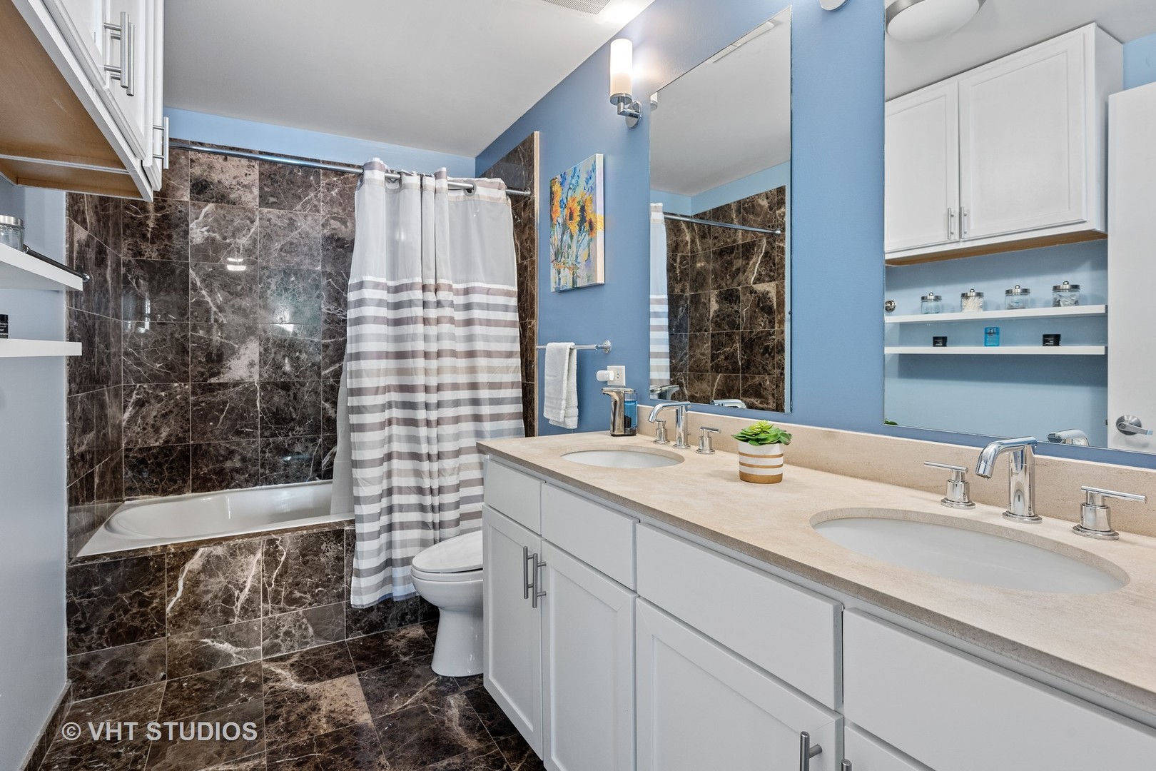3920 North Sheridan Road, Unit 403 Chicago, IL 60613 - Photo 8 of 13 a bathroom with a sink toilet and shower