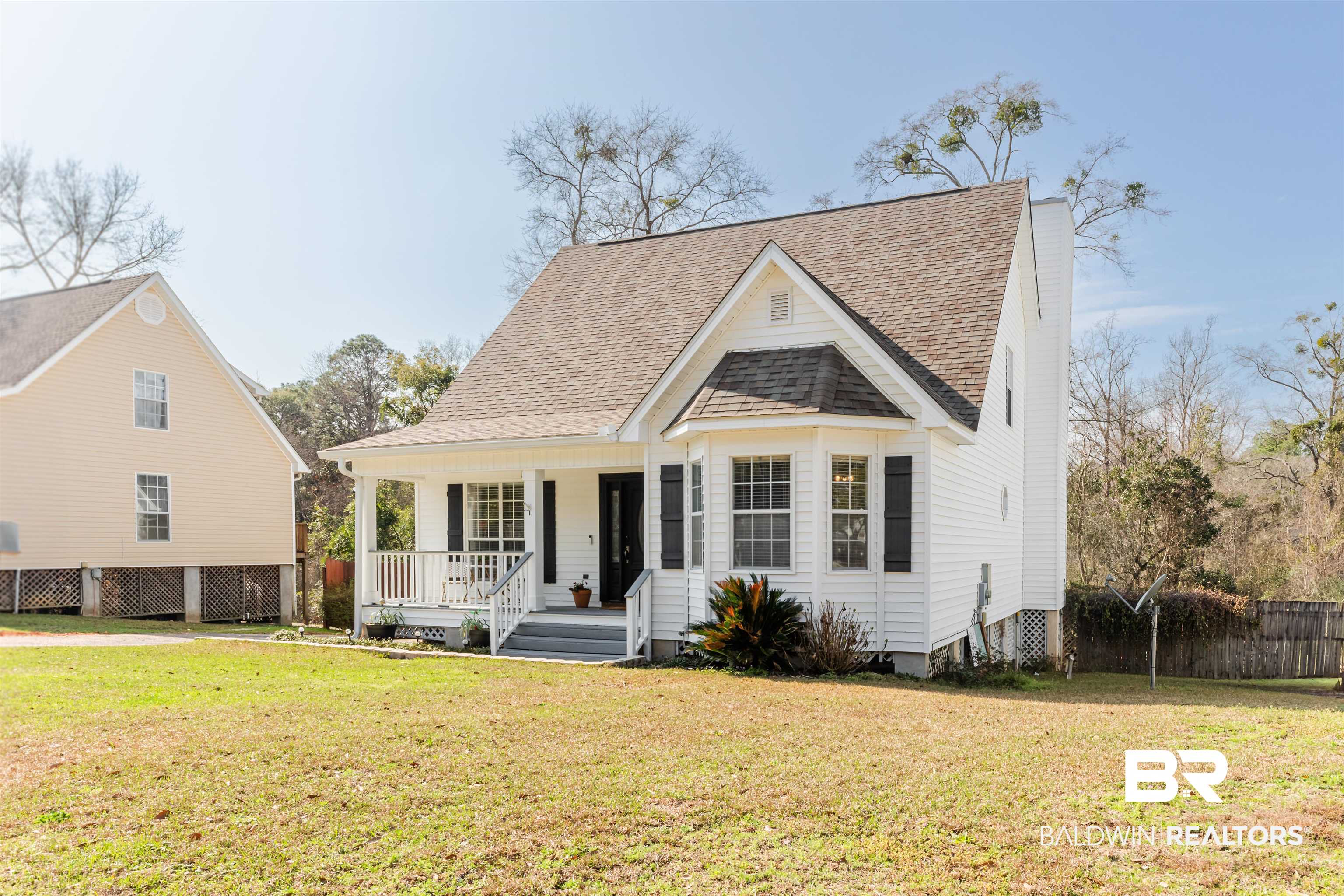 3844 Isabel Way South Mobile, AL 36693 - Photo 2 of 49 View of front of house with a porch and a front lawn