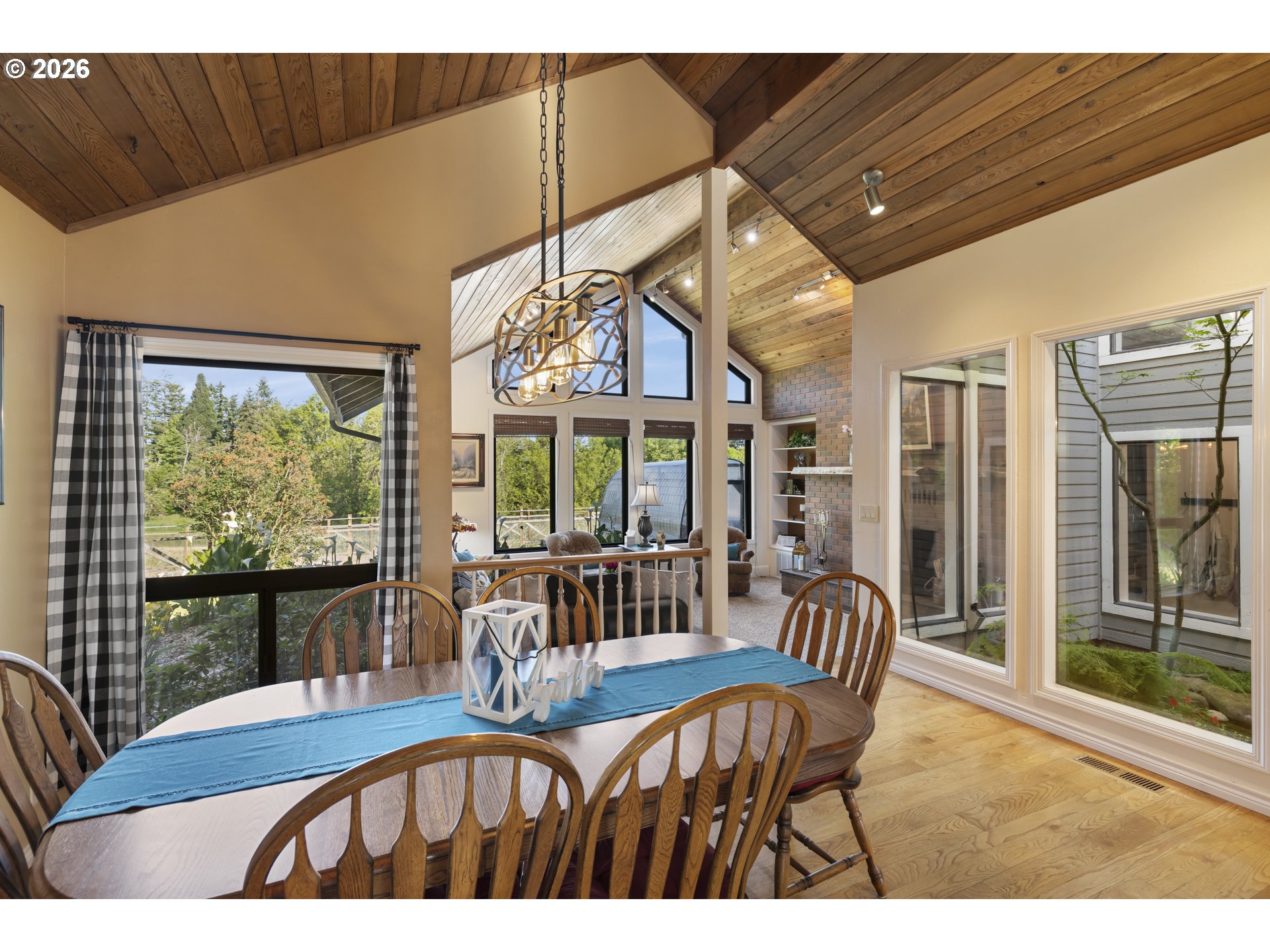 4515 Cordon Road Northeast Salem, OR 97305 - Photo 8 of 48 a view of a dining room with furniture large windows and wooden floor