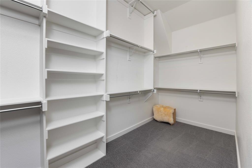 631 Cobblestone Lane Irving, TX 75039 - Photo 24 of 32 a view of an empty walk in closet