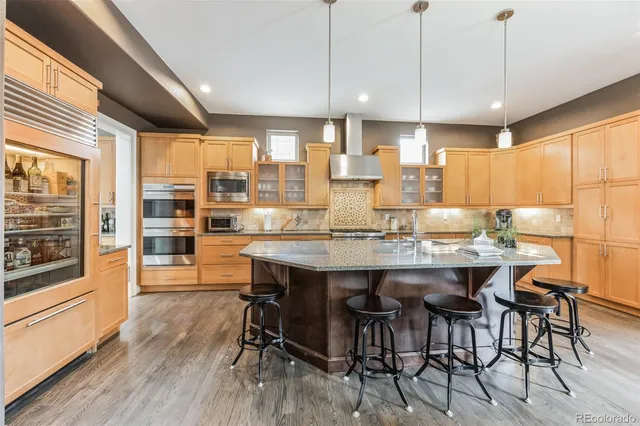 a dining table with chairs and wooden floor