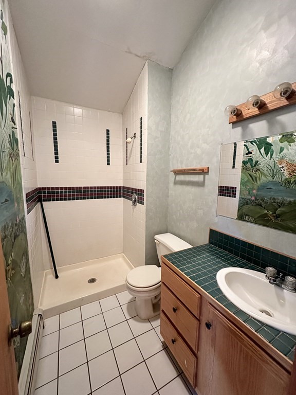 89 NW Road Westhampton, MA 01027 - Photo 14 of 29 a bathroom with a sink toilet and shower