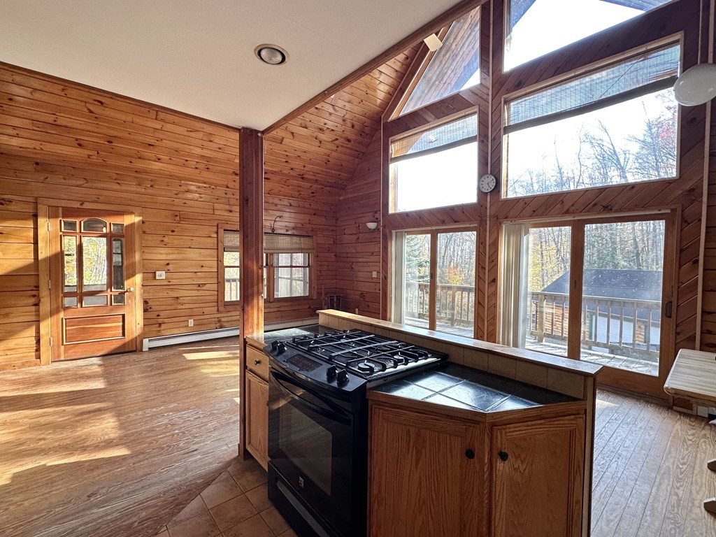 89 NW Road Westhampton, MA 01027 - Photo 17 of 29 a kitchen that has a stove and a wooden floor