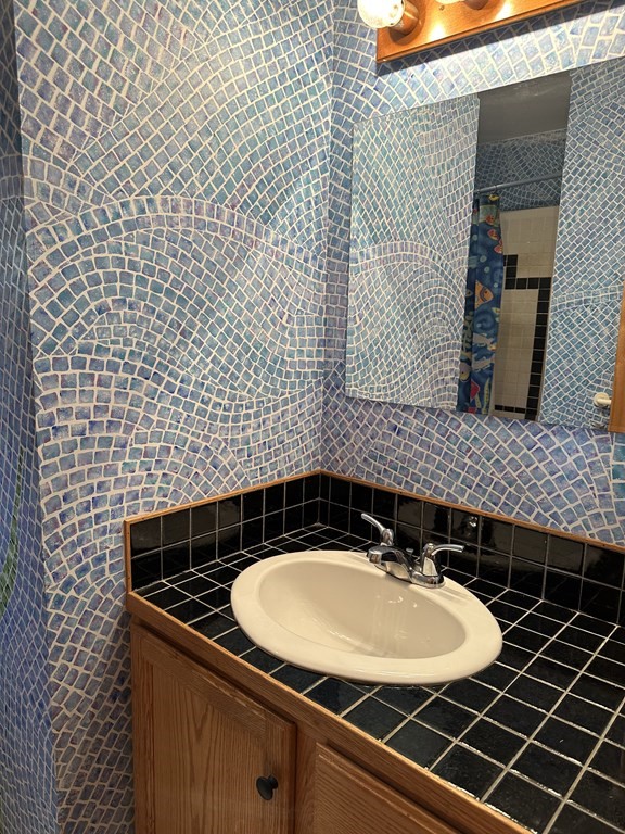 89 NW Road Westhampton, MA 01027 - Photo 20 of 29 a bathroom with a sink and a mirror