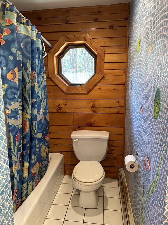 89 NW Road Westhampton, MA 01027 - Photo 21 of 29 a bathroom with a toilet and a shower curtain