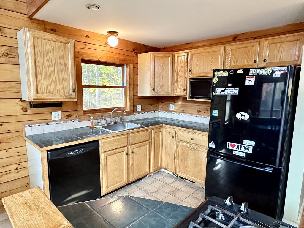 89 NW Road Westhampton, MA 01027 - Photo 25 of 29 a kitchen with stainless steel appliances granite countertop a stove a sink and a refrigerator