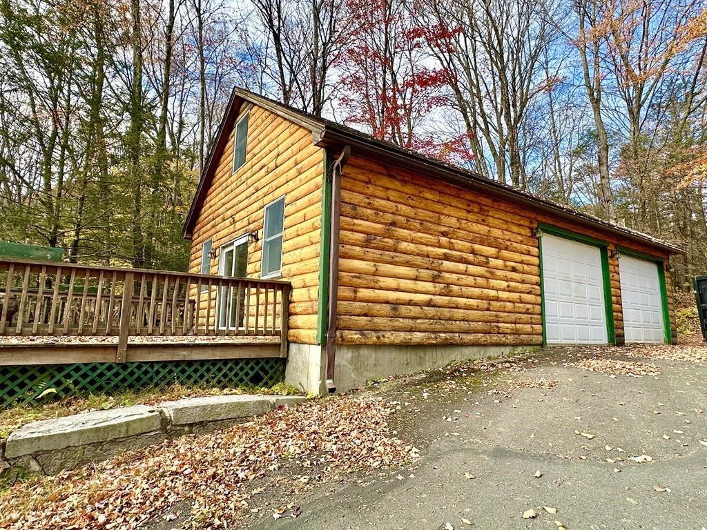 89 NW Road Westhampton, MA 01027 - Photo 4 of 29 a view of a house with a wooden fence