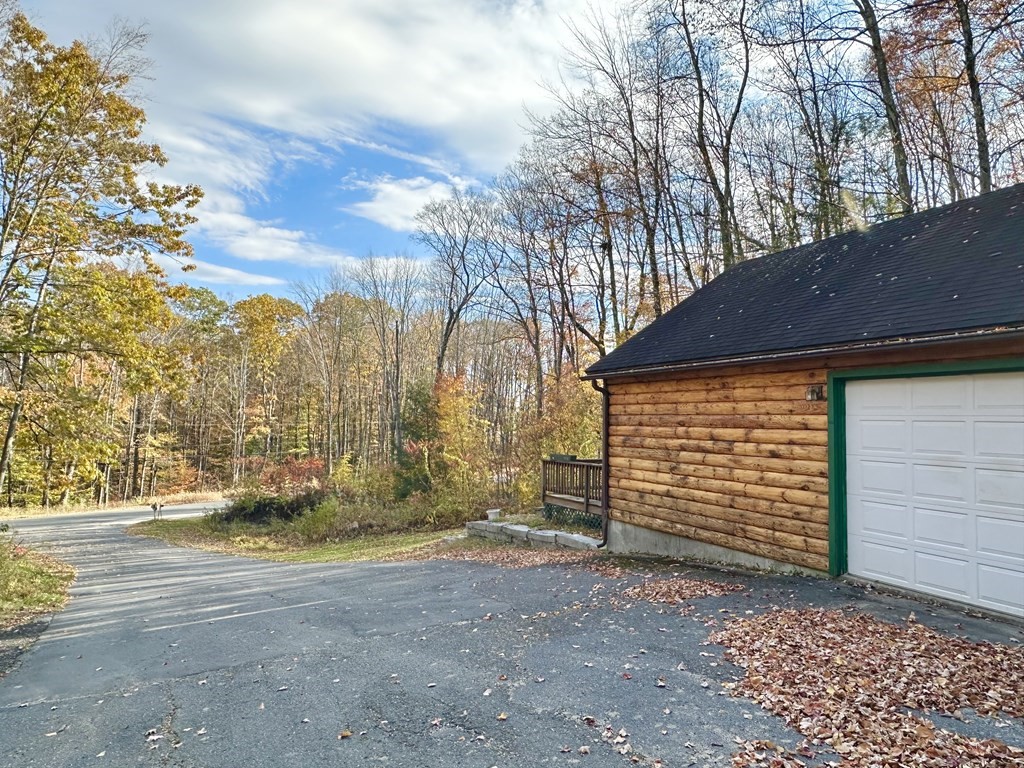89 NW Road Westhampton, MA 01027 - Photo 8 of 29 a view of a house with a yard and garage