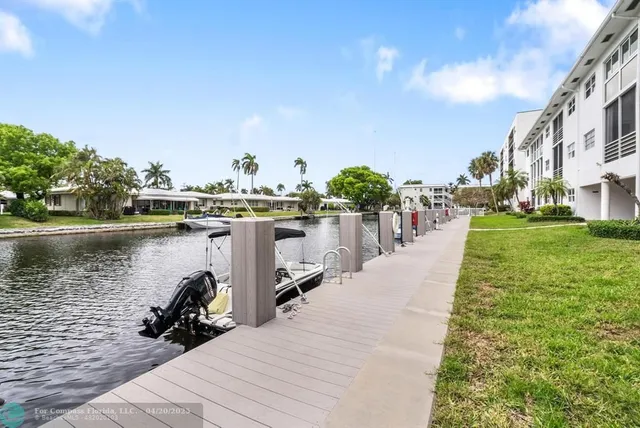 a dining room with furniture a fireplace and wooden floor