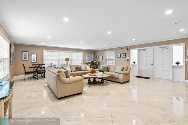 a view of a living room with windows