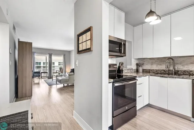 a view of a living room and a couch in a room