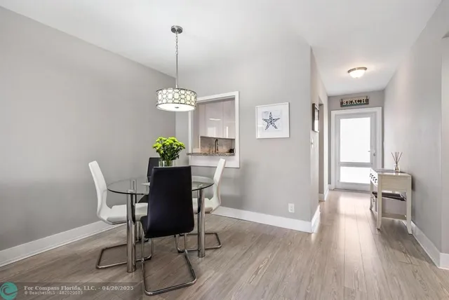 a kitchen with stainless steel appliances granite countertop a sink a refrigerator and a granite counter tops