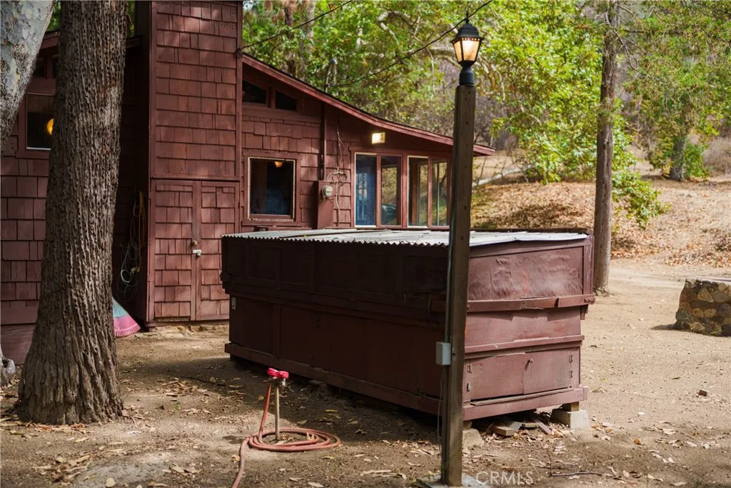 0 Hot Springs Canyon Road, Unit 26 San Juan Capistrano, CA 92675 - Photo 16 of 59 a front view of a house with a yard