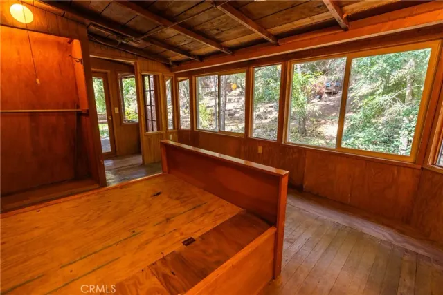 a room with a window and ceiling fan