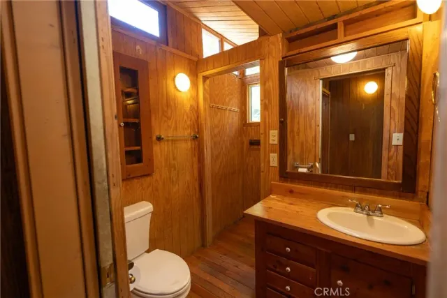 a view of a hall with wooden floor