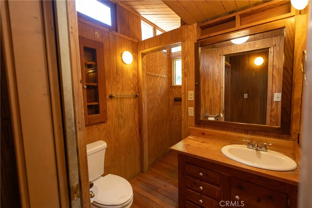 0 Hot Springs Canyon Road, Unit 26 San Juan Capistrano, CA 92675 - Photo 31 of 59 a bathroom with a sink a toilet and shower