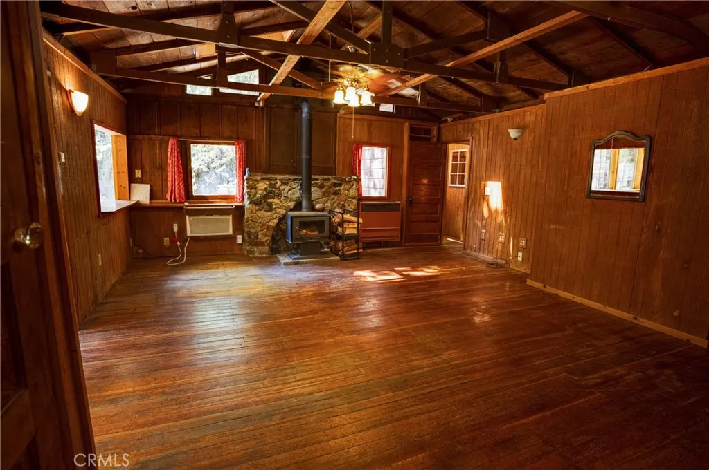 0 Hot Springs Canyon Road, Unit 26 San Juan Capistrano, CA 92675 - Photo 37 of 59 a view of a hall with wooden floor